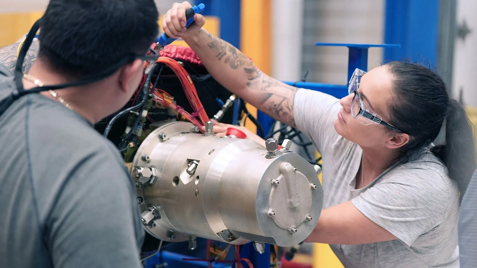 Collins Aerospace technicians assembling a component in Santa Isabel