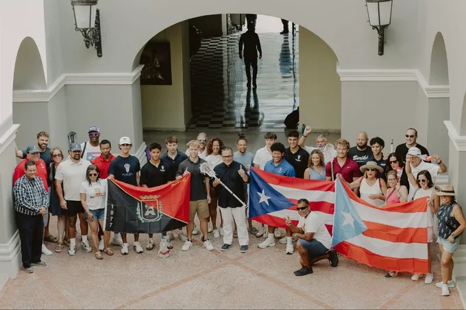 Community and players with Puerto Rico flags