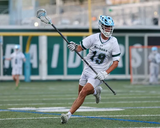 The editor playing lacrosse for the Raiders